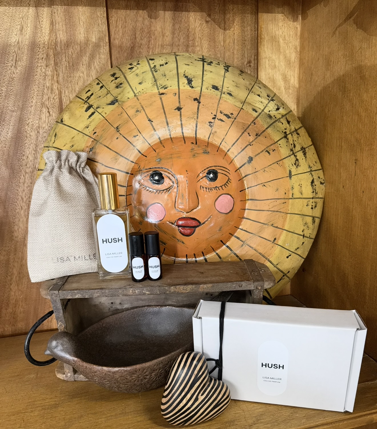 Hush products and eco-friendly packaging — bottle, rollers, gift box and fabric pouch